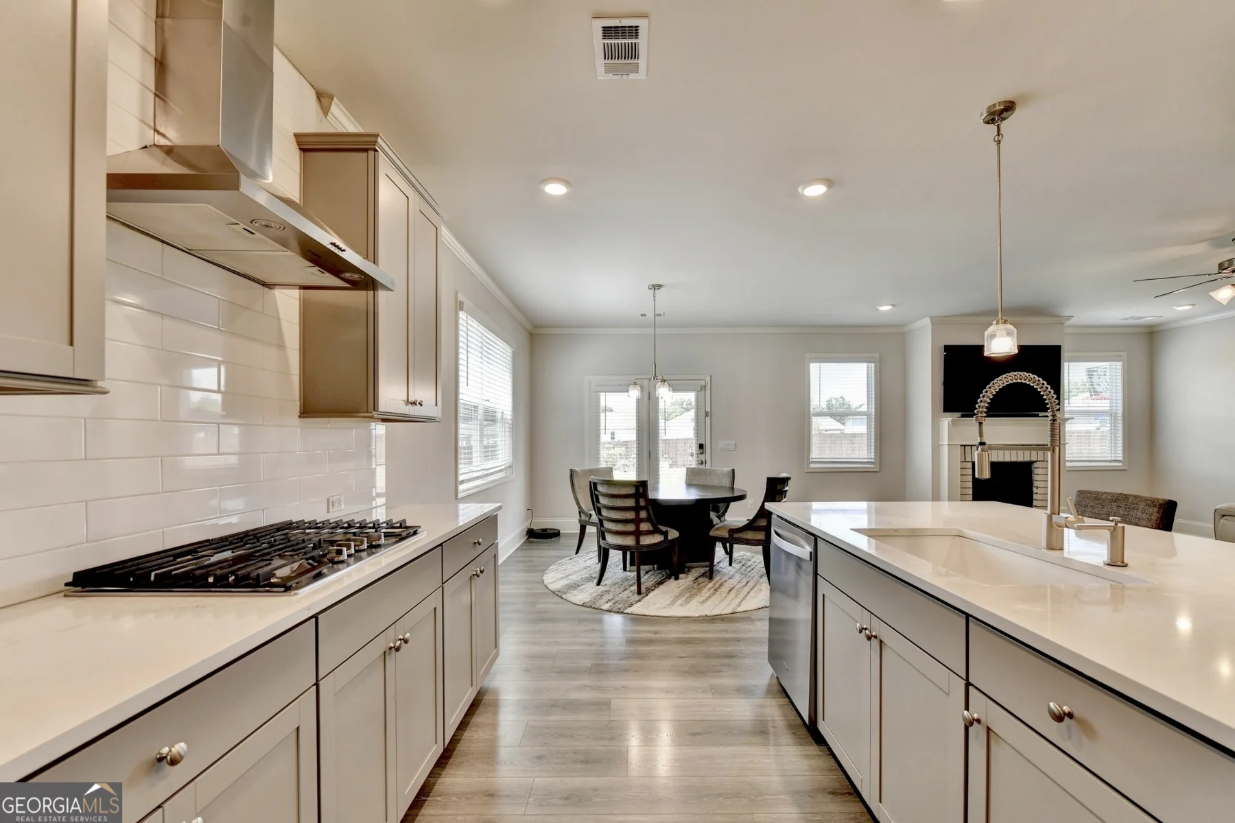 Kitchen with wide island and gas cooktop