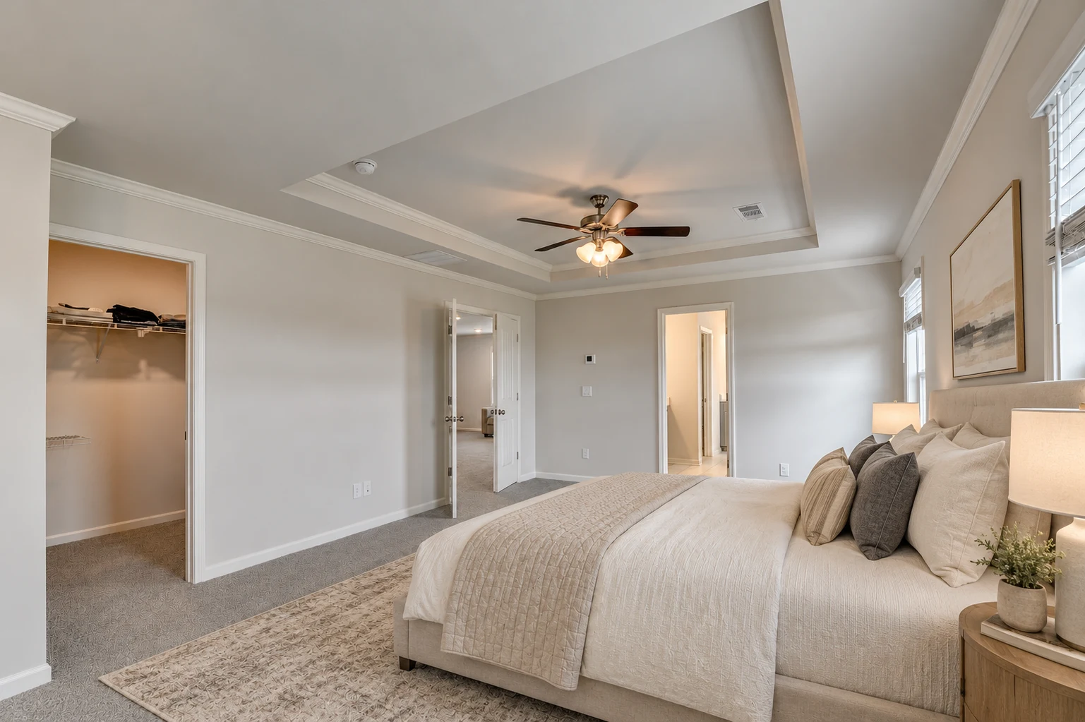 Primary bedroom with tray ceiling — virtually staged